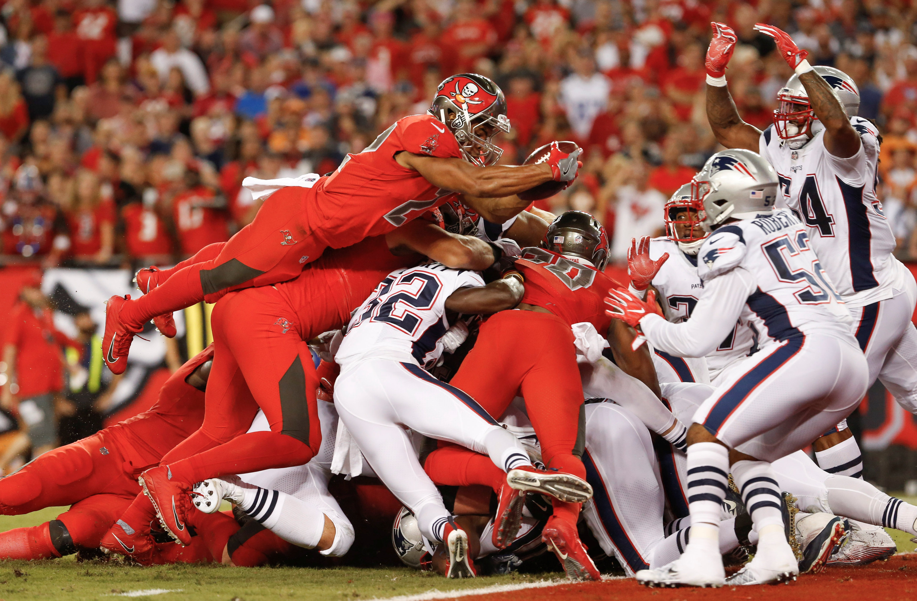 126 Oct 5, 2017; Tampa, FL, USA; Tampa Bay Buccaneers running back Doug Martin (22) leaps over the pile for a touchdown during the second quarter of an football game against the New England Patriots at Raymond James Stadium. Mandatory Credit: Reinhold Mat
